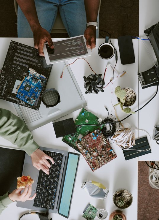 analyzing-circuit-boards-on-modern-office-desk-2025-07-21-23-39-27-utc