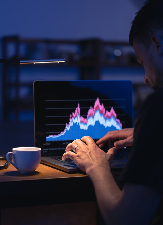 broker-looking-at-laptop-analyzing-stock-market-in-2025-03-14-02-47-25-utc