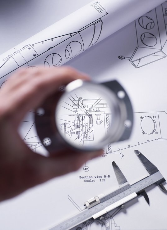 engineer-holding-a-precision-made-component-over-a-2025-04-04-08-13-02-utc