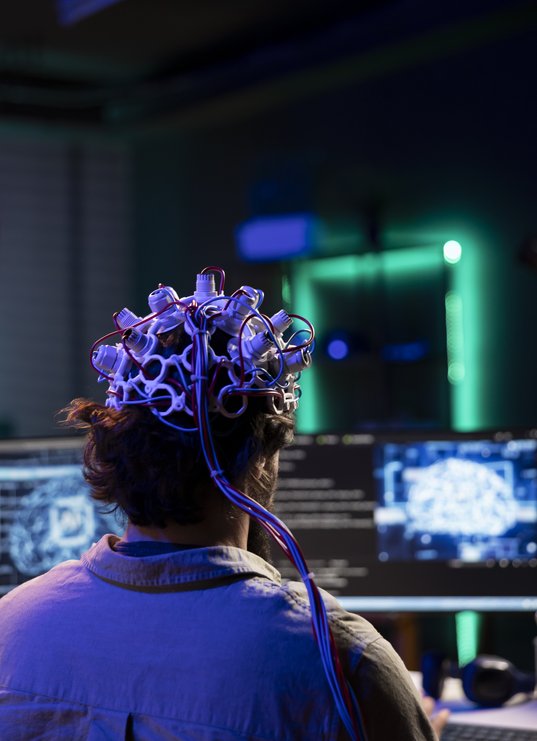 engineer-with-eeg-headset-on-programming-brain-tra-2025-02-19-22-58-13-utc