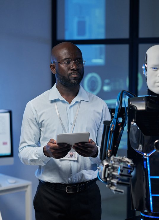 man-using-tablet-pc-to-control-the-robot-2025-03-08-21-40-01-utc